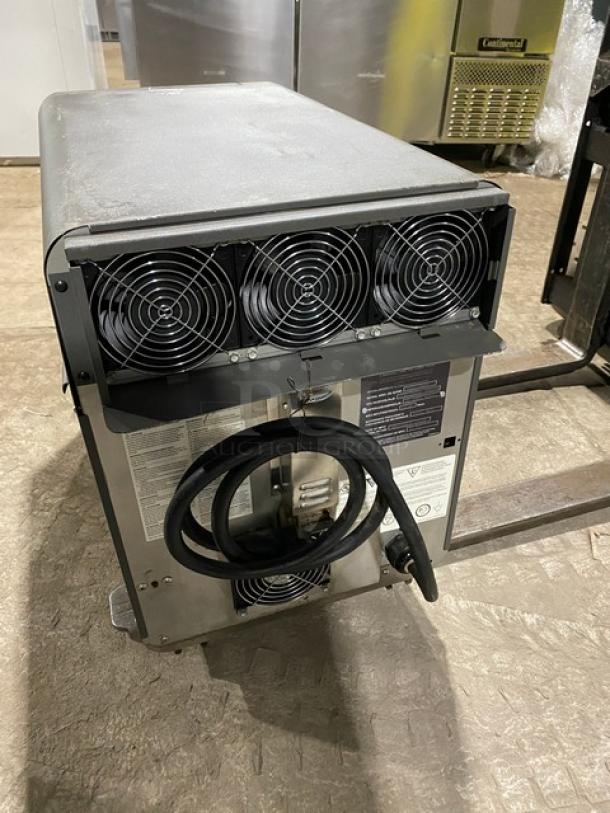 TurboChef NGO commercial rapid cook oven, electric, digital controls, rear view showing fans and power cord, on legs.