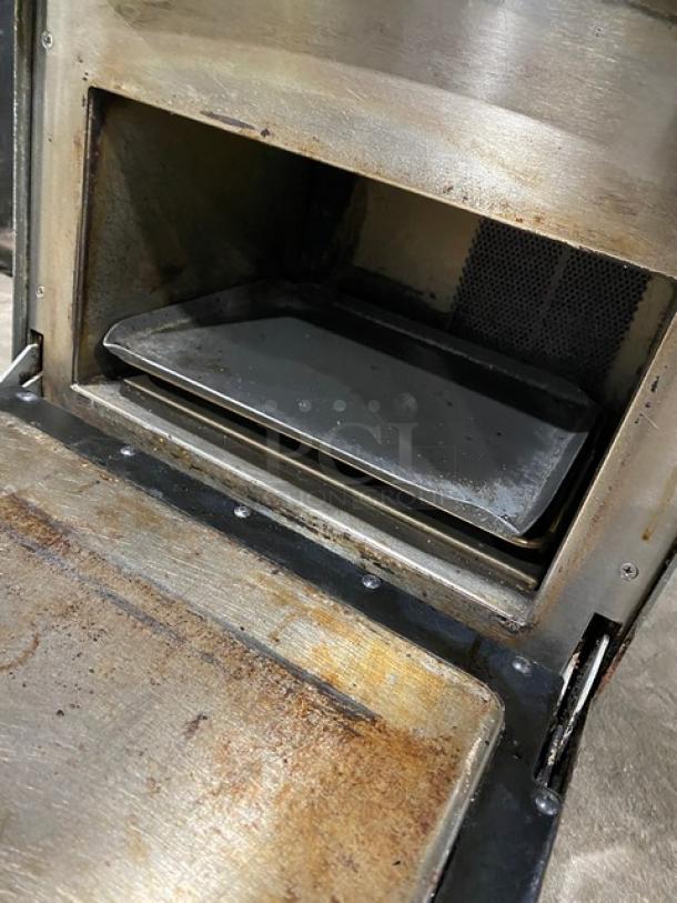 TurboChef NGO commercial electric rapid cook oven with digital push controls, on legs, visible wear inside.