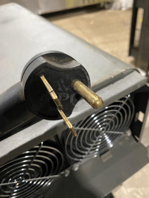 TurboChef NGO commercial rapid cook oven plug, showing power connector and rear cooling fans.