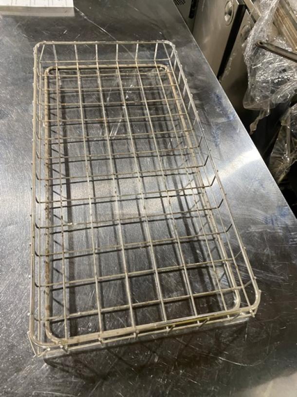 Commercial chrome-plated full-size wired rack for bagels and pastries, in good condition, for bakery display use.