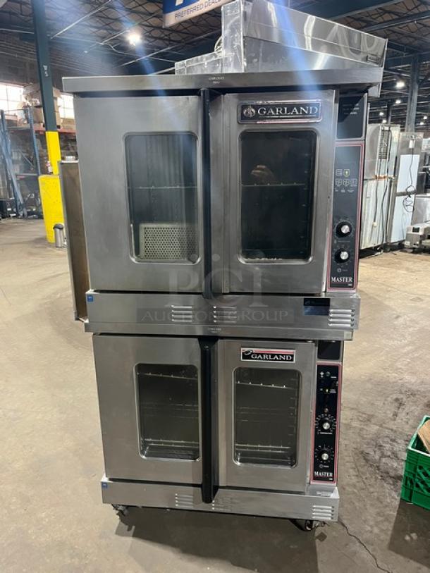 Garland Master 200/300 Series double stacked convection oven, natural gas, view-through doors, wire racks, commercial casters.