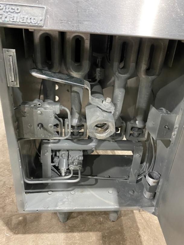 Pitco Frialator Series commercial stainless steel natural gas deep fat fryer, interior view with mechanics and back splash.