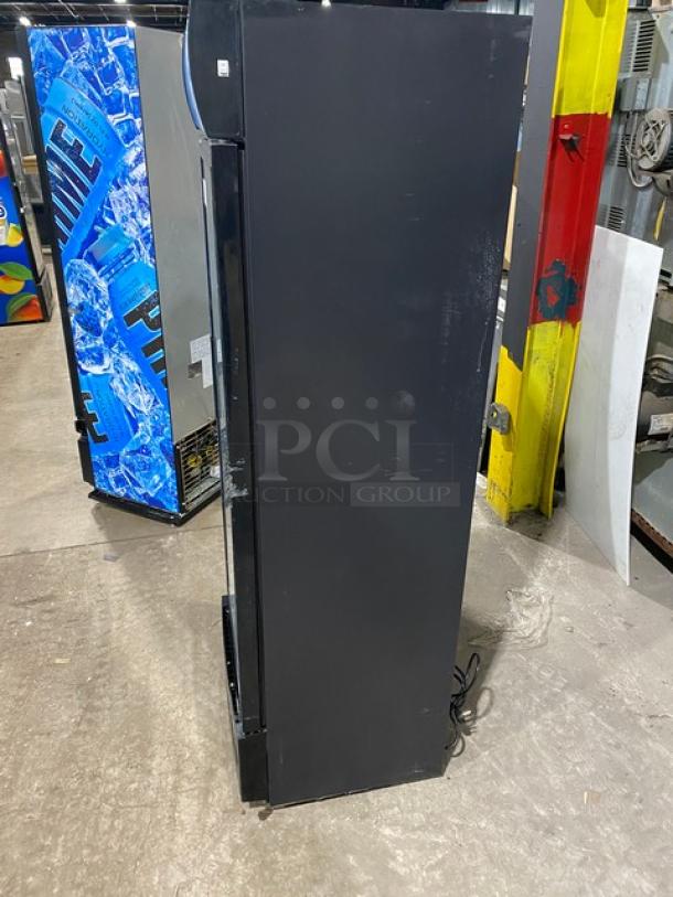 KoolMore MDR-9CP commercial refrigerator, black, glass swing door, poly coated rack, and 115V power, visibly used.