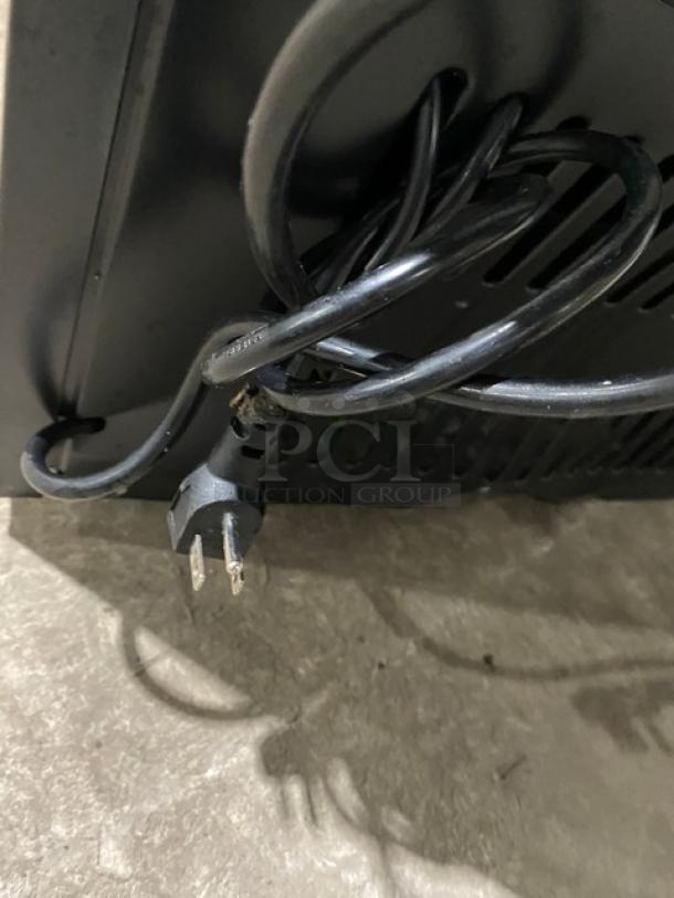 Close-up of power cord for KoolMore Commercial Refrigerator Model MDR9CP. Black, 115V, poly-coated wired rack included.