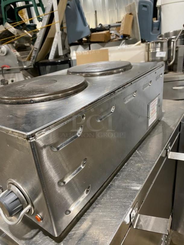 Wells Commercial Stainless Steel 2-Burner Hotplate, electric-powered with individual controls, in used condition.