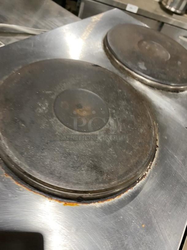 Wells Commercial stainless steel electric 2-burner hotplate with individual controls, visible wear on burners.