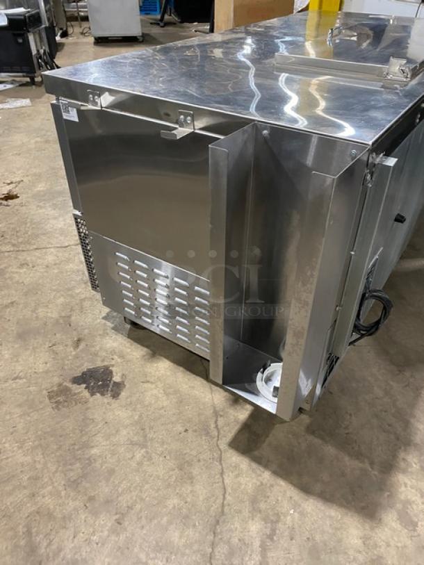 Continental stainless steel 3-door refrigerated prep table, model RA6BNB, on casters, with poly coated wire rack.