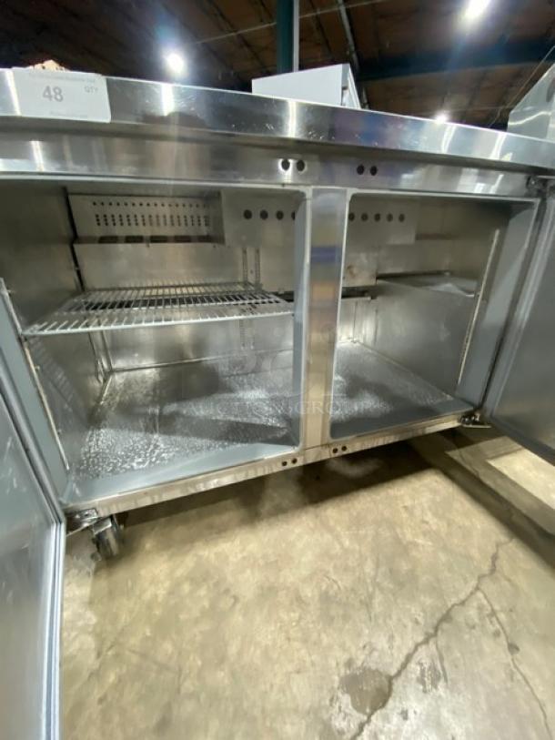 Continental 3-door refrigerated prep table with poly coated rack, model RA6BNB, on casters, stainless steel, 115V 1 Phase.