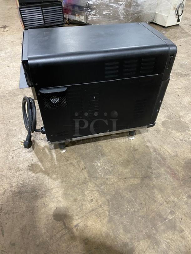 TurboChef NGO Turbo Oven, electric countertop model, black, rapid cook, ventless, with crank bar, 2021, on legs.