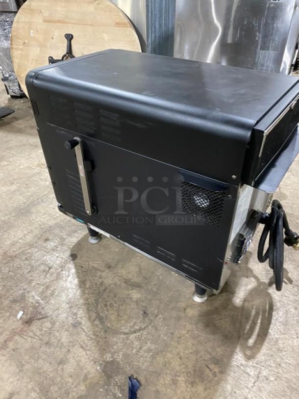 TurboChef NGO 2021 ventless rapid cook oven in black. Features crank bar, legs, and operates on 208/240V 1 phase. Model NGOTD44230.