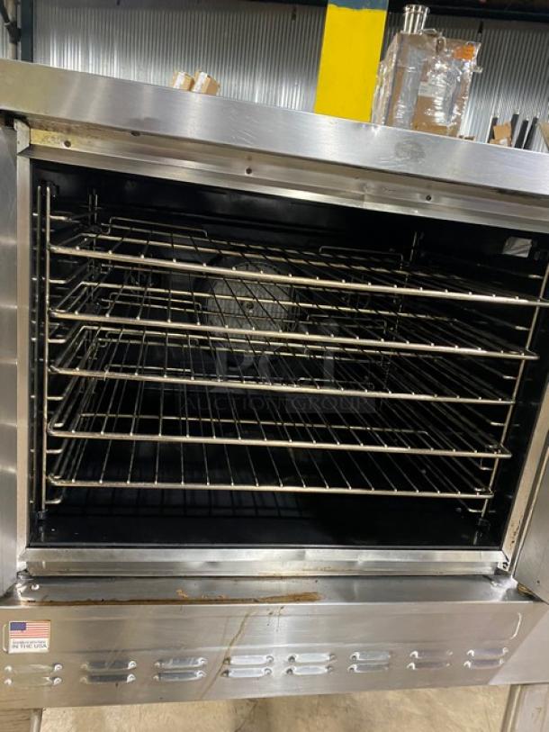 Blodgett commercial stainless steel gas convection oven with wired oven rack, single stacked, on legs, used condition.