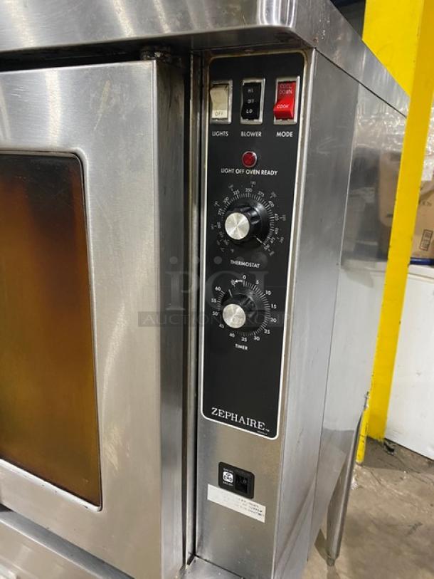 Blodgett commercial stainless steel gas convection oven, single stacked on legs. Features include thermostat dials and a wired oven rack. Model Zephaire.
