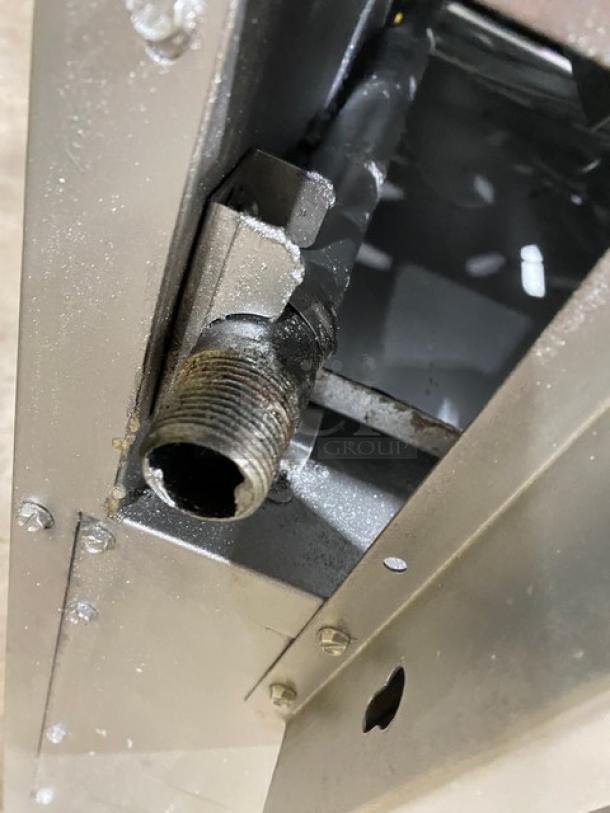 CPG stainless steel gas 10-burner range and double oven combo, features wired oven rack, visible connection details.