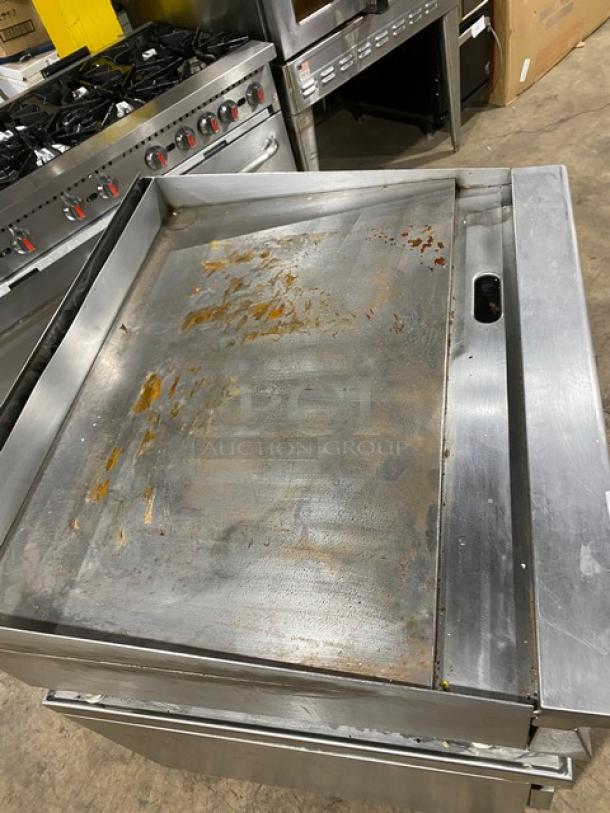 Garland commercial stainless steel countertop flat griddle, model GTGG36GT36M, natural gas, on legs, used condition.