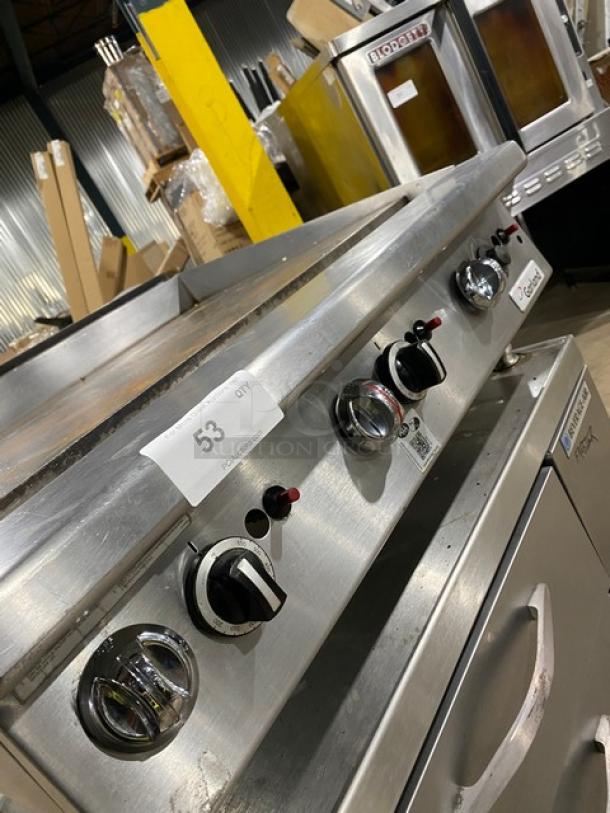 Garland GTGG36-GT36M stainless steel gas griddle, countertop model with controls, on legs. Serial: 1709100101336.