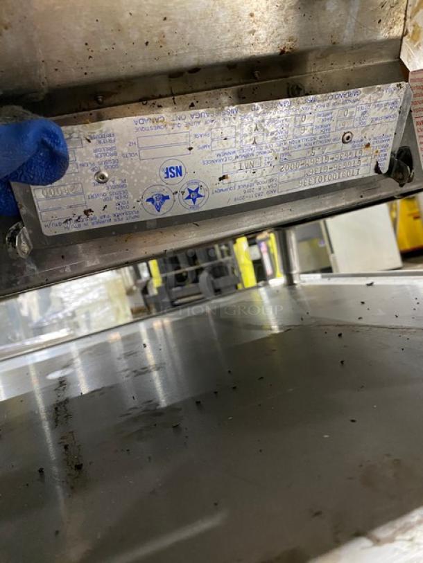 Garland GTGG36-GT36M stainless steel countertop griddle, natural gas, with leg supports, visible model and serial number plate.