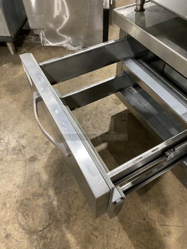 Beverage-Air stainless steel 2-drawer refrigerated chef base, model WTFCS36D-1, on casters, open drawer view.