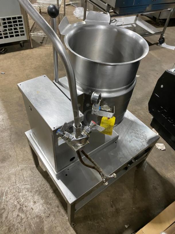 Cleveland Range stainless steel steam jacketed tilting kettle on stand with swing spout faucet and single drawer, used condition.