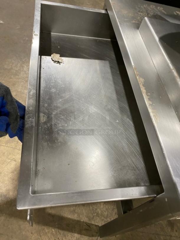 Cleveland Range stainless steel steam jacketed tilting kettle with swing spout faucet and single drawer equipment stand.