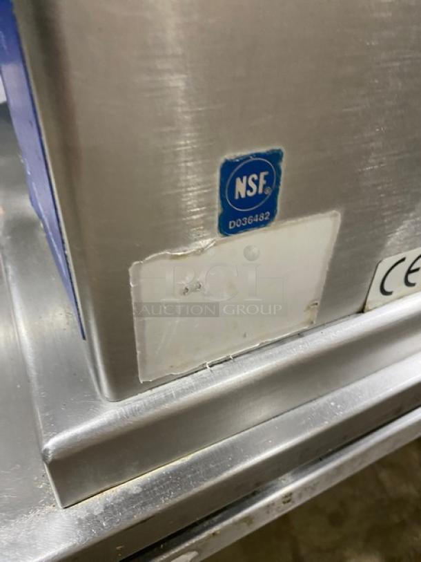 Cleveland Range stainless steel steam-jacketed kettle with swing spout faucet, NSF certified, on equipment stand.