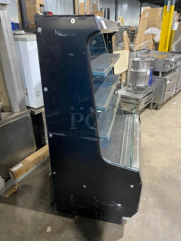 Turbo Air TOM-40M(B) black multi-tier refrigerated open merchandiser with stainless steel interior, used condition.