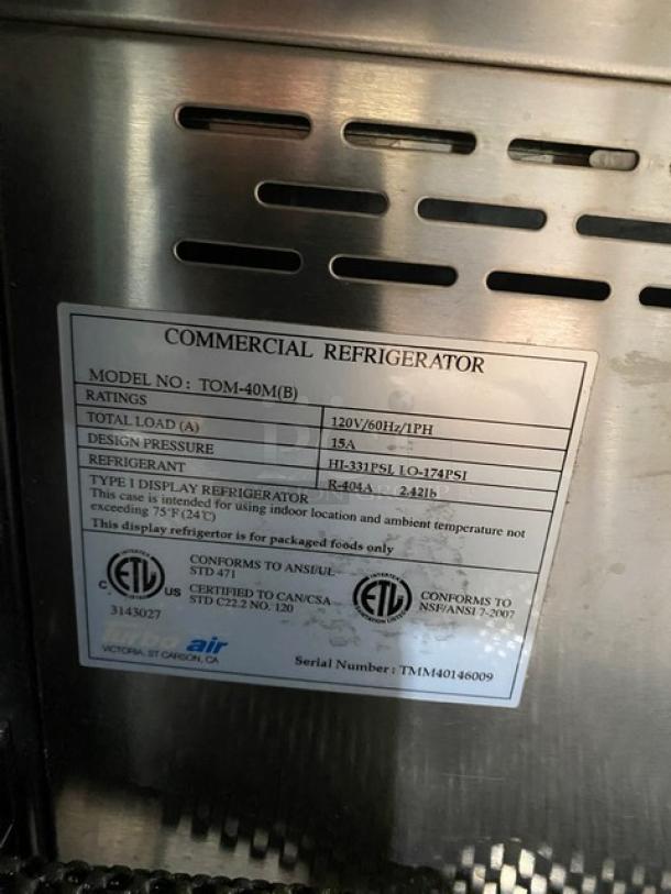 Turbo Air TOM-40M(B) multi-tier refrigerated display case with stainless steel interior and open grab-n-go design.