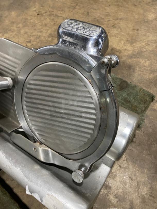 Globe Model 660 deli meat slicer, electric-powered, countertop use with legs, serial number 674425, visible wear, working condition.