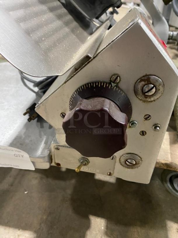 Globe 660 commercial electric deli slicer, countertop model on legs, adjustment knob, SN: 674425, used condition.