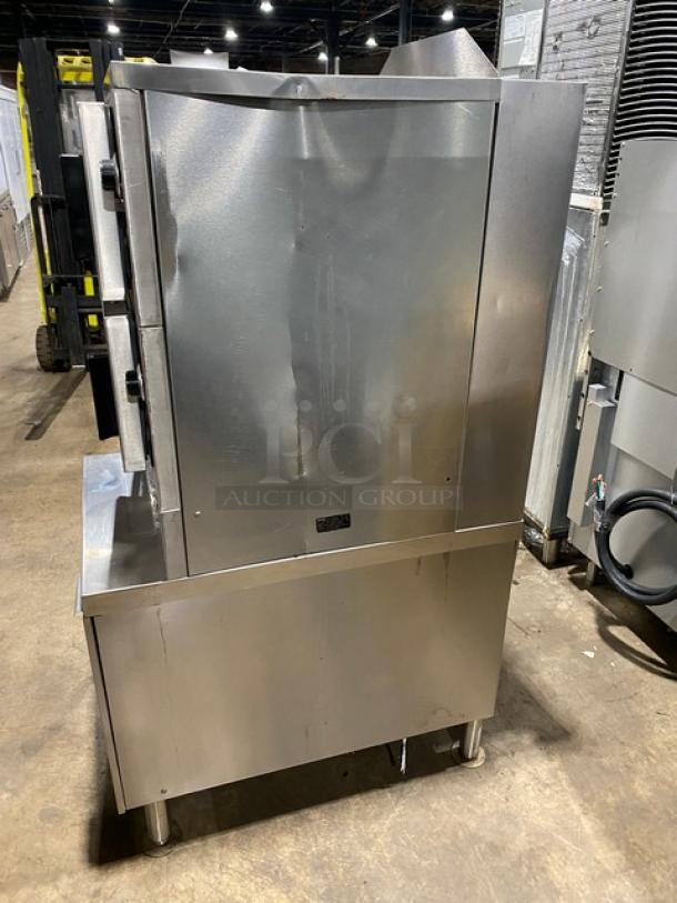 Vulcan VSX24G stainless steel dual compartment convection steamer with individual controls, built-in pan rack, on legs.