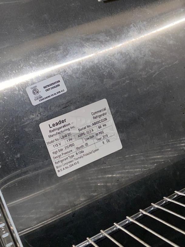 Leader LB48SC commercial stainless steel lowboy refrigerator with double glass sliding doors, chrome rack, and visible labels.