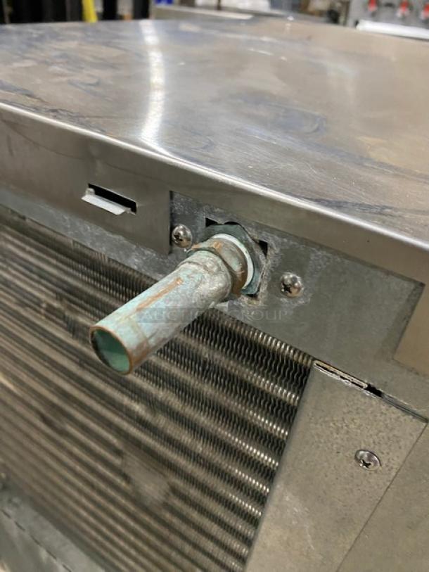 Hoshizaki KM-660MAJ ice machine head, stainless steel, air-cooled, crescent cube style, visible wear, model and serial tags.