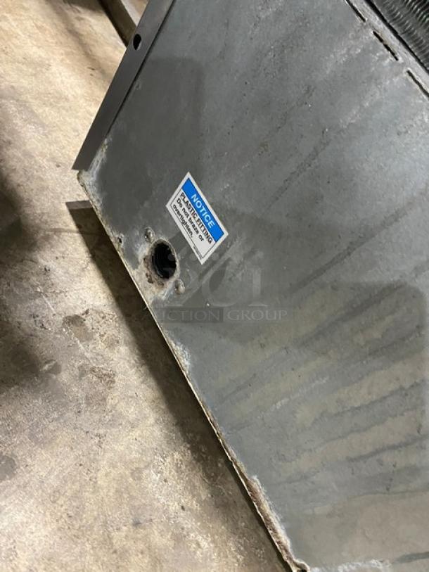 Hoshizaki KM-660MAJ ice maker, stainless steel, used condition, air-cooled, Crescent Cube style. Model and notice label visible.