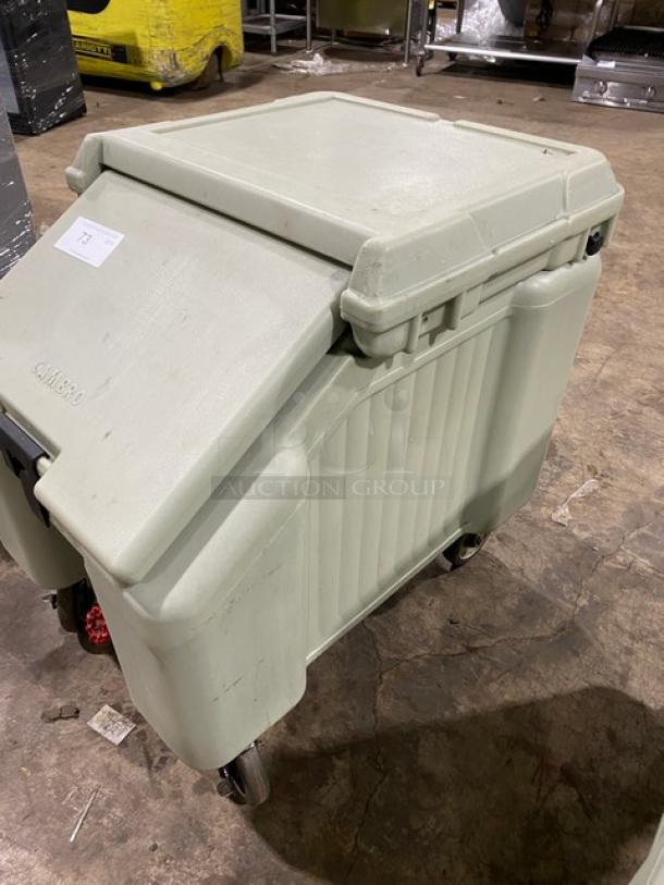 Cambro commercial insulated ice bin on wheels, light gray, sturdy condition, Cambro branding visible on lid.