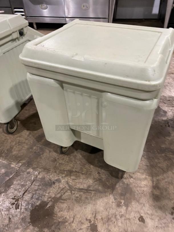 Cambro commercial insulated ice bin, white, on wheels, square shape, durable plastic, minor surface wear, suitable for catering.