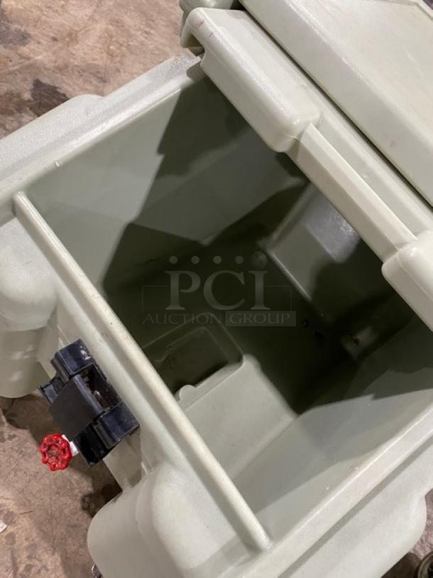 Cambro Commercial Insulated Ice Bin, light gray, durable plastic, good condition, features a hinged lid and drainage spout.