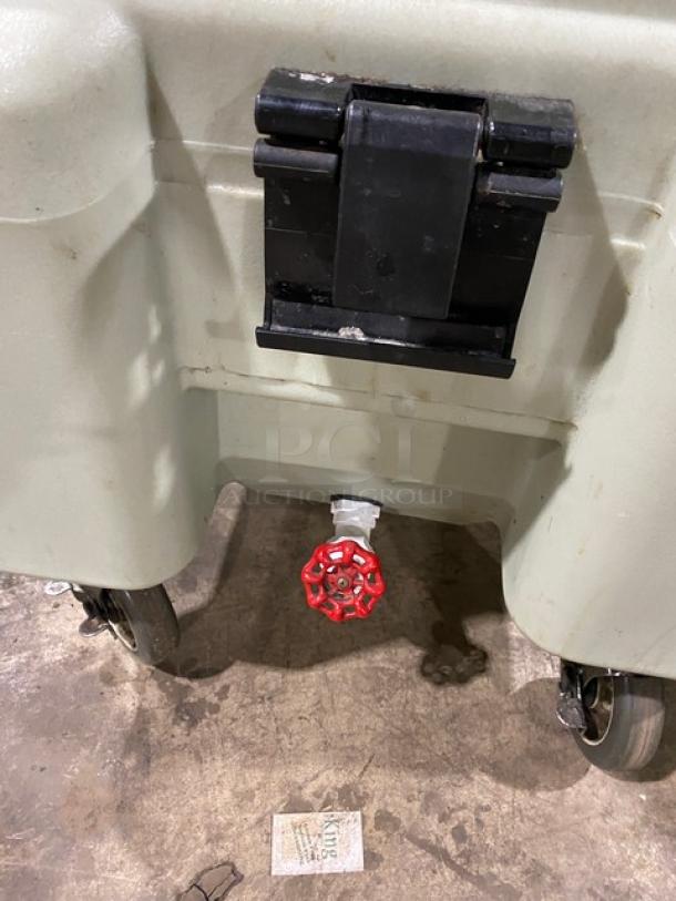Cambro commercial insulated ice bin, features durable wheels, red drain valve, secure black latch, in good used condition.