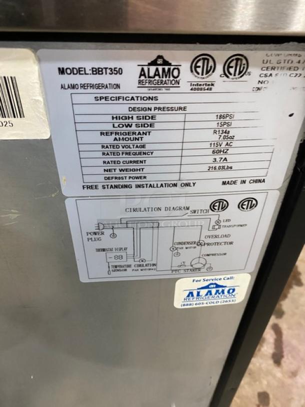 Alamo BBT350 black glass 3-door undercounter cooler, poly-coated wired rack, stainless steel top, specifications label visible.