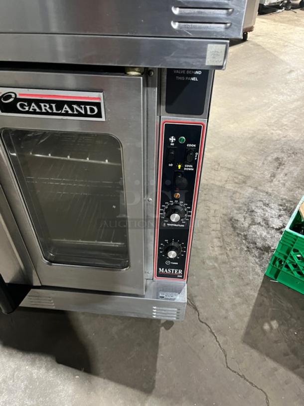 Garland Master 200/300 Series double stacked convection oven, natural gas, view-through doors, on commercial casters.