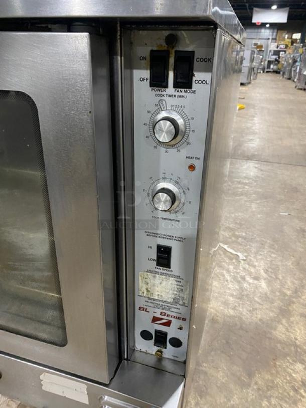 Southbend commercial stainless steel convection oven, gas-powered, single stack, thermostatic control, wired rack, on legs.