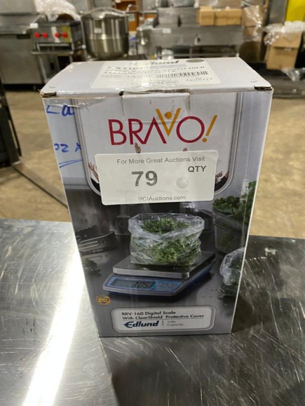 BRAND NEW Edlund Bravo Series BRV-160, 10 lb digital portion scale in box. Features ClearShield cover and LCD display. SN: 014622.