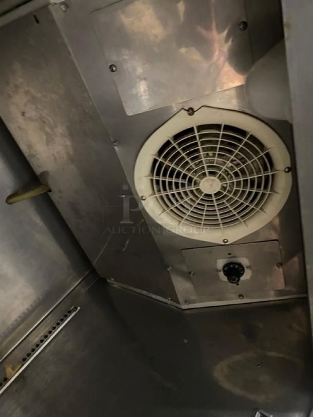 Turbo Air TSR-23D stainless steel refrigerator interior, featuring a fan and control knob. Model: TSR23D, SN: RN01623104.