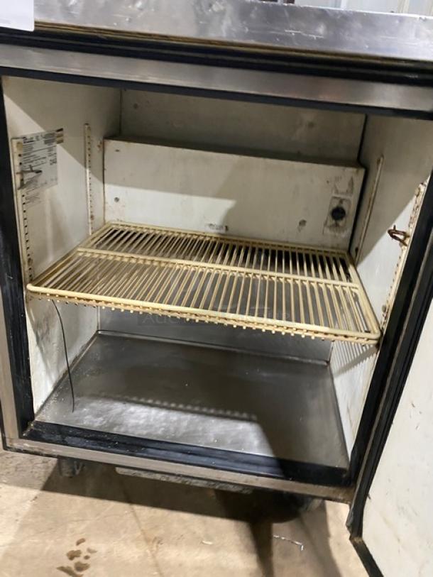 True TWT-27 commercial stainless steel refrigerator, single door, 27" worktop, poly coated wired rack, on casters, working condition.