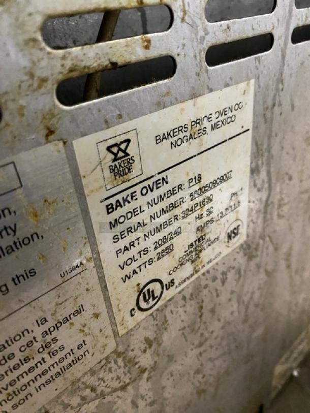Bakers Pride P18 electric pizza oven label showing model, serial number, and voltage details.