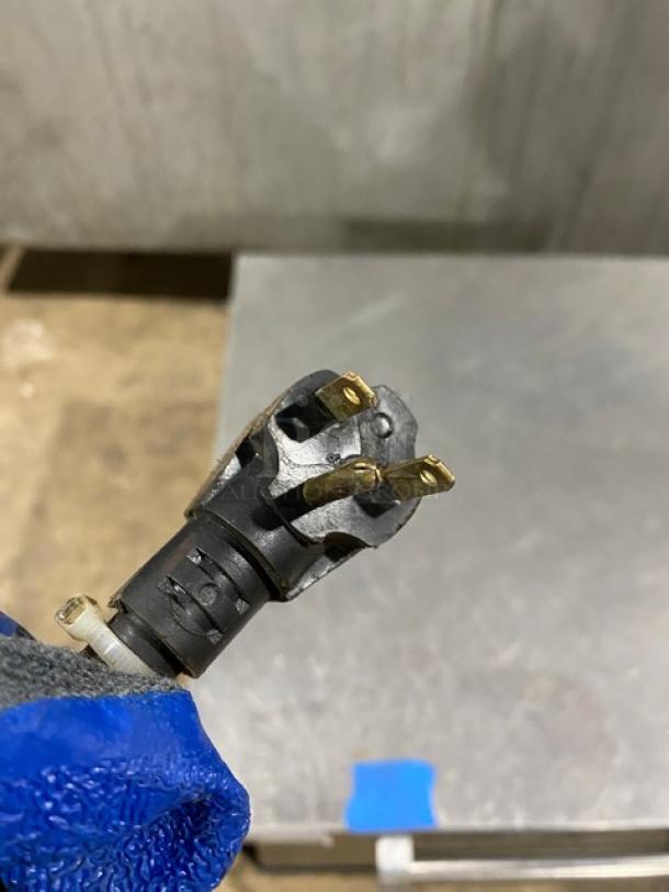 Detailed view of power plug for Bakers Pride model P18 commercial stainless steel electric pizza oven, 208/240V, 1 Phase.