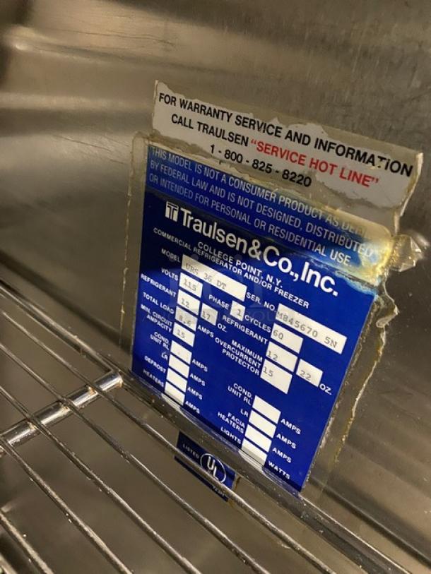 Traulsen URS36DT stainless steel 2-door, 3-drawer fridge/freezer combo with chrome racks, model/serial tags visible.