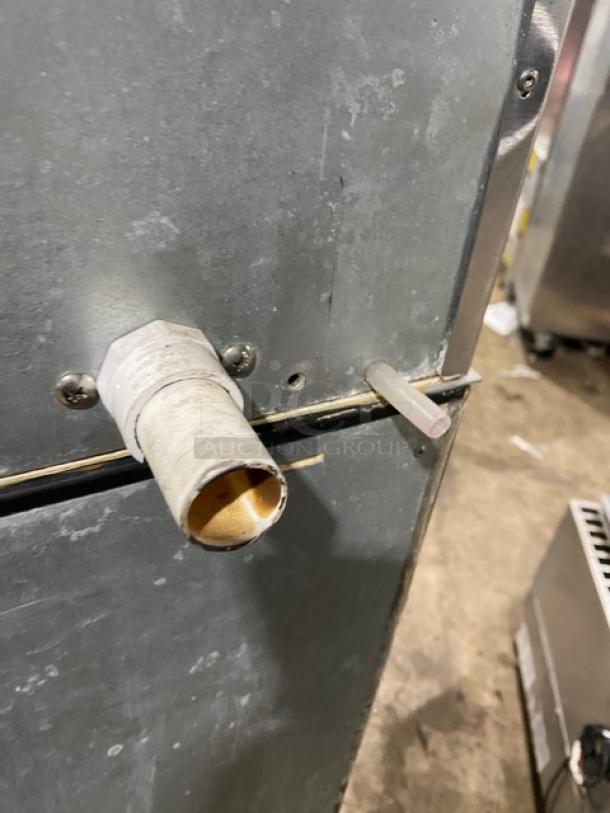 Hoshizaki KM-515MAH commercial ice maker, stainless steel, shown from the side with visible fittings, air-cooled, 120V, 1 phase.