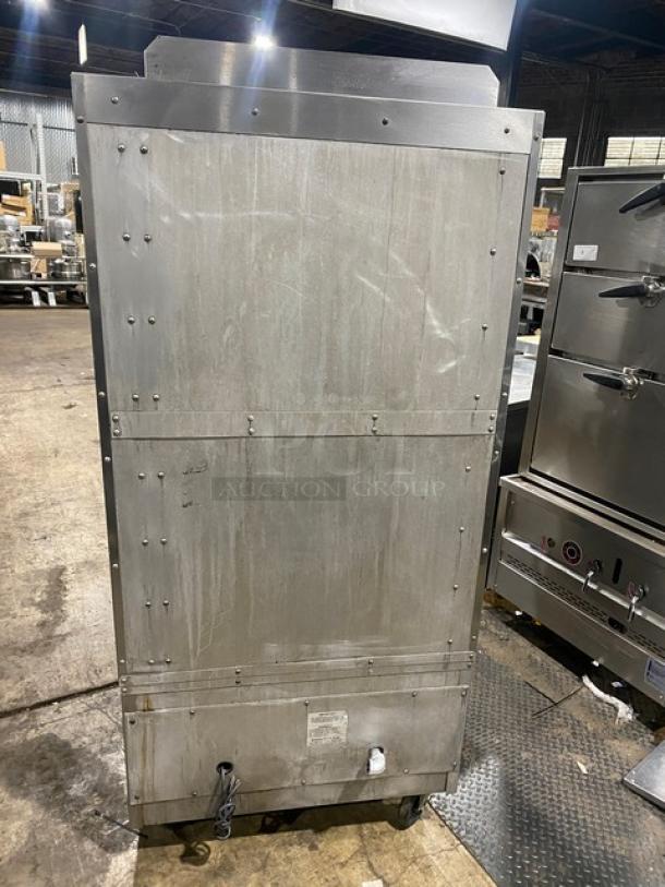 Southbend stainless steel gas upright double deck infrared broiler on casters, commercial-grade, back view.