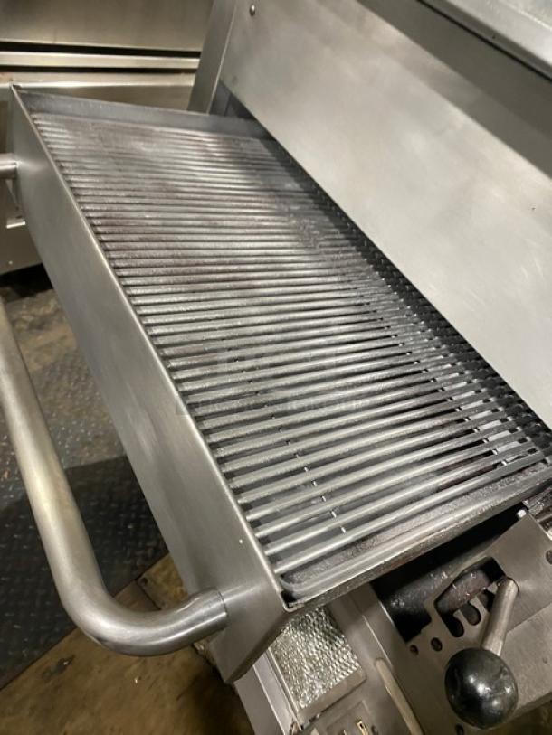 Southbend commercial stainless steel gas-powered upright double-deck infrared broiler on casters. Grill grate and controls shown.