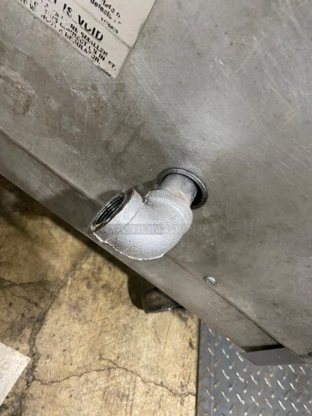 Southbend stainless steel gas-powered upright broiler corner showing plumbing fitting, on casters. Used condition.