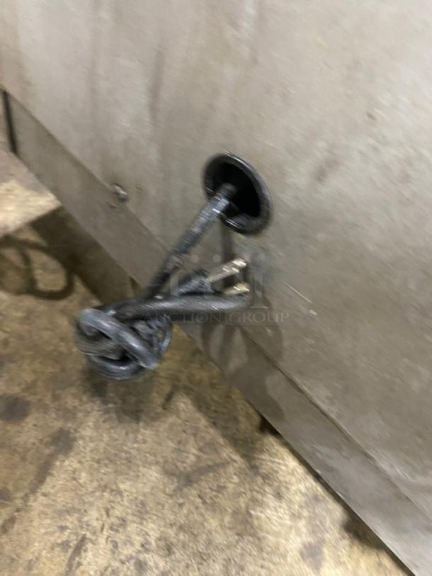 Southbend stainless steel gas-powered upright double deck infrared broiler, on casters, partially shown with braided cord.